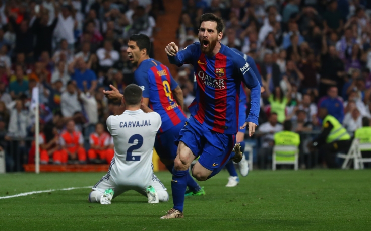Barcelona's Lionel Messi celebrates scoring their third goal